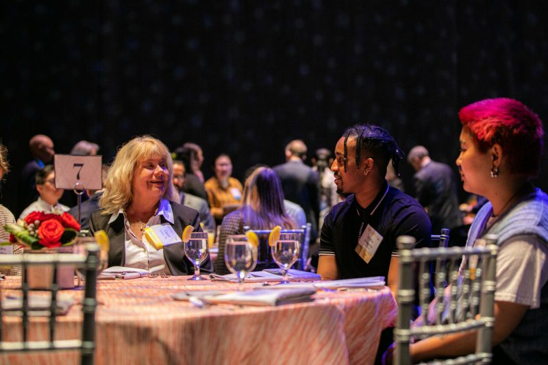A donor talks with scholars at a Beyond Boundaries reception