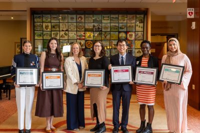 Aspire Award winners posing with their award certificates.
